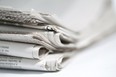 Newspapers folded and stacked. Photo by fotolia.com