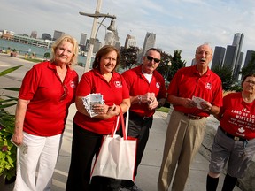 Supporters of the Great Canadian Flag Project, Monica Totten, Suzanne Allison, Randy Voakes, Michael Beale and Margo Barnet are pictured at the foot of Ouellette Avenue in Windsor on Friday, Aug. 14, 2015. (DYLAN KRISTY/The Windsor Star)