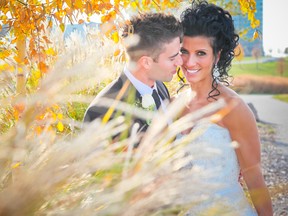 Framing this beautiful wedding couple is fall foliage bursting out in colour which can be found in Windsor-Essex.