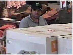 A surveillance photo of a suspect Windsor police said allegedly stole cash from cash registers at the Real Canadian Superstores on Walker Road and Dougall Avenue on Aug. 16, 2015. (Courtesy of Windsor police)