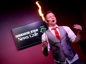 Kobbler Jay (professional busker Jason Henderson) prepares to eat fire in The Star's News Cafe on Aug. 14, 2015. (Dylan Kristy / The Windsor Star)