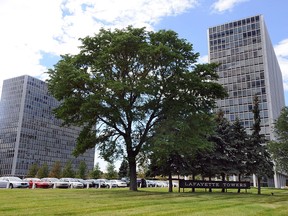Dotted with high-rises and historic architecture, the Lafayette Park neighborhood that sits northeast of downtown Detroit, Mich., was named a national historic landmark Tuesday, Aug. 4, 2015. The National Park Service announced Tuesday, the neighborhood redeveloped in the mid-20th century featuring the architecture of Ludwig Mies van der Rohe and three other sites nationwide are being added to the list of historic landmarks. (Brandy Baker/Detroit News via AP)