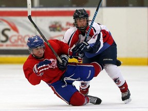 Lakeshore Canadiens' Colin Sartor collides with Wheatley Omstead Sharks' Eric Prudence in a Great Lakes Junior C exhibition game at the Atlas Tube Centre in Lakeshore, Ontario on August 28, 2015. (JASON KRYK/The Windsor Star)