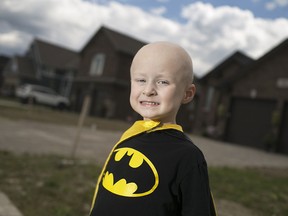 Mason Macri wears his batman shirt and cape at his Lakeshore home on Aug. 1, 2015.