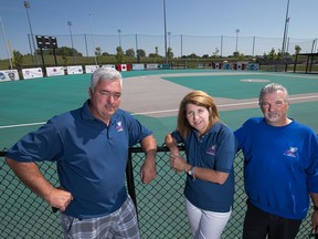 Members of the Miracle League of Amherstburg, from left, Chuck Bondy, president, Michele Vigneaux, public relations and media, and Brian McGee, capital projects director, are pictured in front of the Miracle League Field at the Libro Credit Union Centre, Sunday, August 23, 2015.  The field will be getting a new surface and scoreboard.  (DAX MELMER/The Windsor Star)
