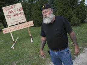 Bob Laidlaw, a homeowner adjacent to Recycling Makes Cents, protests with other residents outside the recycling facility, Saturday, August 29, 2015.  They are protesting the company's expansion plans.  (DAX MELMER/The Windsor Star)