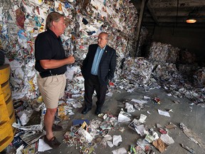 Craig Whittaker (left) gives councillor Ed Sleiman a tour of the Recycling Makes Cents facility in Windsor on Thursday, Aug. 6, 2015. The facility is looking to expand their operation.                          (TYLER BROWNBRIDGE/The Windsor Star)