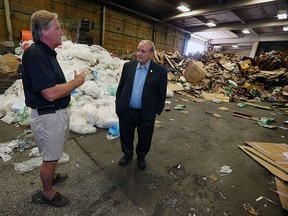 Craig Whittaker (left) gives councillor Ed Sleiman a tour of the Recycling Makes Cents facility in Windsor on Thursday, Aug. 6, 2015. The facility is looking to expand their operation.                          (TYLER BROWNBRIDGE/The Windsor Star)