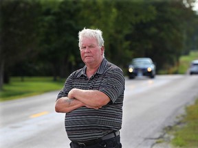 Essex councillor Larry Snively stands on Concession Road 4 on August 14, 2015 where he wants the speed limit on from McCormick Side Road east to Arner changed from 80 km/h to 60 km/h. (DAN JANISSE/The Windsor Star)