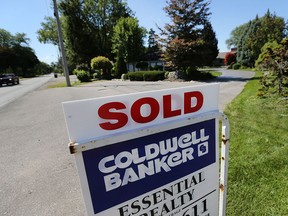 A residential sold sign is shown along Riverside Drive East on Thursday, Aug. 6, 2015, in Windsor, Ont. The real estate market continues to sizzle. (DAN JANISSE/The Windsor Star)