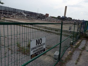 A tower at the former GM transmission plant remains standing after three explosive attempts failed to bring it down in Windsor on Monday, August 10, 2015.