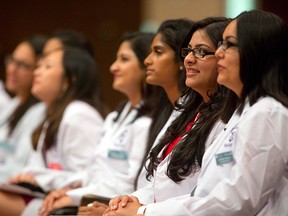 The Schulich School of Medicine and Denistry held their white coat ceremony at Alumni Hall at Western University in London on Aug. 25, 2015. The Windsor satellite campus  will host the Canadian Federation of Medical Students annual general meeting, a first for Windsor. (Mike Hensen/Postmedia News)