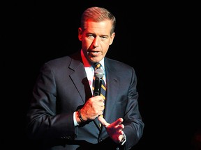 In this Nov. 5, 2014 file photo, Brian Williams speaks at the 8th Annual Stand Up For Heroes, presented by New York Comedy Festival and The Bob Woodruff Foundation in New York. Next week marks the end of Brian Williams' six-month suspension from NBC News for exaggerating his role in news reporting, but he isn't expected back on the air in his new job at MSNBC for at least another month. (Photo by Brad Barket/Invision/AP, File)