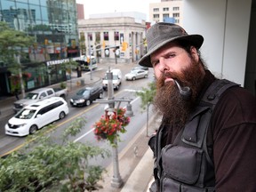Portrait of busker, Andrew Nellis for story on panhandlers forming a union under the banner of the Industrial Workers of the World. Their local acronym is SLOW -- Street Labourers of Windsor. Nellis is a tarot card reader. (JASON KRYK/The Windsor Star