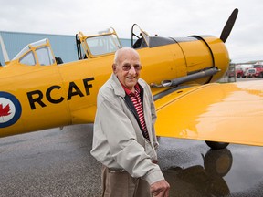 Russel St. Pierre, 90, a Second World War veteran who was training to be a navigator in the Royal Canadian Air Force during the war, takes a ride in a North American Harvard at the Windsor International Airport, Saturday, Aug. 8, 2015.  St. Pierre was given the ride for his 90th birthday.     (DAX MELMER/The Windsor Star)