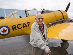 Russel St. Pierre, 90, a Second World War veteran who was training to be a navigator in the Royal Canadian Air Force during the war, takes a ride in a North American Harvard at the Windsor International Airport, Saturday, Aug. 8, 2015.  St. Pierre was given the ride for his 90th birthday.     (DAX MELMER/The Windsor Star)