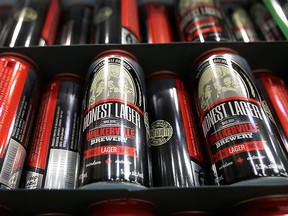 The Walkerville Brewery's recent success has given the company an opportunity to expand. A huge fermentation tank was delivered last week. Shown are cans of the Honest Lager brew. (DAN JANISSE/The Windsor Star)
