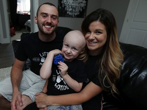 Mason Macri and his parents — Iain Macri and Chantelle Bacon —  are heading to Houston, Tex., so Mason can receive treatment for his rare form of cancer. (TYLER BROWNBRIDGE / The Windsor Star)