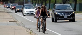 Drivers and cyclists alike will be affected by new traffic laws taking effect on Sept. 1. For instance, drivers who don’t give cyclists a minimum of one metre of space when passing will incur a $110 fine and two demerit points. (TYLER BROWNBRIDGE / Windsor Star files)