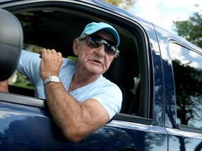 Mervin Yaholnitsky, 68, comments on the white flag campaign throughout Windsor's Remington Park neighbourhood on Monday, Aug. 24, 2015. Yaholnitsky has lived in the neighbourhood on Alexandrine Street for 40 years. (DYLAN KRISTY/The Windsor Star)