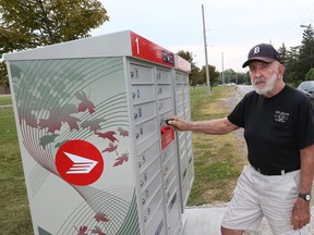 Riverside Drive resident Paul Murray stands next to a new Canada Post mailbox in the 11000 block of Riverside Drive east in Windsor, Ont. on Aug. 17, 2015.  (JASON KRYK/The Windsor Star)