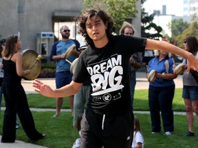 Dance activist Egemen Aktas, front, joined a demonstration by Save Ojibway members and area drummers at City Hall Monday August 31, 2015.  OMB is holding a hearing to determine the fate of property near Ojibway Nature Centre and Prairie Reserve Tuesday August 31, 2015.  (NICK BRANCACCIO/The Windsor Star)  Battagello story