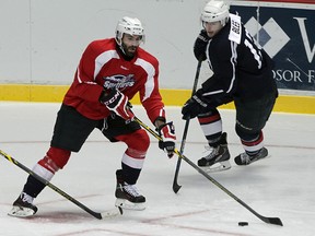 Spitfires forward Bradley Latour, left, makes a move in front of Tyler Biles during  a training camp scrimmage at WFCU September 1, 2015.  (NICK BRANCACCIO/The Windsor Star)