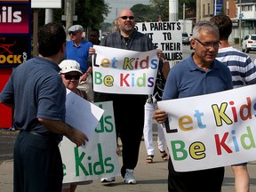 Demonstrators against the new sex education curriculum protest at office of MPP Lisa Gretzky on Tecumseh Road East, Wednesday September 2, 2015.  (NICK BRANCACCIO/The Windsor Star)