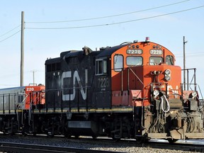 A CN locomotive goes through the CN Taschereau yard in Montreal, Saturday, Nov., 28, 2009. THE CANADIAN PRESS/Graham Hughes