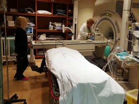 Laurie Casagrande, left,  and Lori Bezarie prepare the MRI for the next patient at Windsor Regional Hospital Met Campus in Windsor on Thursday, Sept. 24, 2015.             (TYLER BROWNBRIDGE/The Windsor Star)