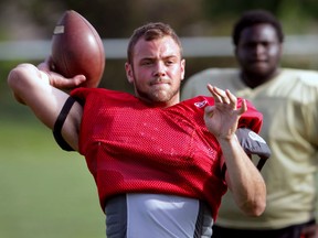 AKO quarterback Austin Lumley warms up during practice at Lajeunesse high school. (NICK BRANCACCIO/The Windsor Star)