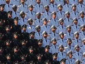 A Chinese military choir stands in position ahead of a military parade later in the morning at Tiananmen Square in Beijing on September 3, 2015, to mark the 70th anniversary of victory over Japan and the end of World War II. A huge military parade rolls through Tiananmen Square as Beijing commemorates the 70th anniversary of Japan's WWII defeat, but major Western leaders are staying away from the show of strength. AFP PHOTO / GREG BAKERGREG BAKER/AFP/Getty Images