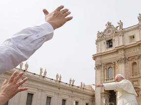 Pope Francis waves as he leaves at the end of his weekly general audience in St. Peter’s Square at the Vatican, Wednesday, Sept. 9, 2015.