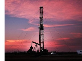 An oil drill is viewed near a construction site for homes and office buildings on February 5, 2015 in Midland, Texas. (Spencer Platt/Postmedia News files)