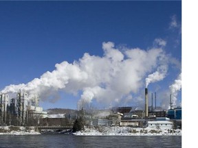 Steam and smoke rise from Tembec's pulp mill beside town February 28, 2008 in Quebec. (Postmedia News Files)
