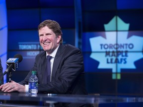 Toronto Maple Leafs' new head coach Mike Babcock laughs during a press conference in Toronto on Thursday, May 21, 2015. THE CANADIAN PRESS/Darren Calabrese