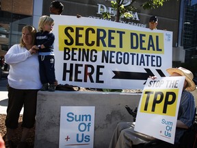 A handful of activists protested outside the Ottawa Delta Hotel on Lyon Street where the government was hosting closed door talks on the Trans-Pacific Partnership (TPP) in July 2014.