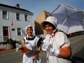 eamstresses Jessie Basden, left, and Helga Bailey, dressed in 1812 attire model some of the 50 costumes in front of the Gordon House February 23, 2012.  The costumes were created to be used to commemorate the War of 1812 events. (NICK BRANCACCIO/The Windsor Star)