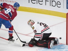 Montreal Canadiens Zack Kassian scores on Chicago Blackhawks goaltender Scott Darling during second period NHL pre-season hockey action in Montreal, Friday, September 25, 2015. THE CANADIAN PRESS/Graham Hughes