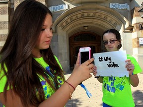 Walkerville Collegiate Institute student Sydney Brouillard-Coyle, right, is photographed by Hailey Caza with #whyvote campaign slogan Sept. 28, 2015.