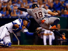 Tyler Collins #18 of the Detroit Tigers is tagged out at home plate by Salvador Perez #13 of the Kansas City Royals during the game at Kauffman Stadium on September 1, 2015 in Kansas City, Missouri.  (Photo by Jamie Squire/Getty Images)