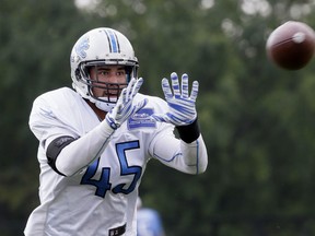 Detroit Lions safety Brian Suite runs through a drill at the Detroit Lions training facility, Tuesday, Sept. 1, 2015, in Allen Park, Mich. (AP Photo/Carlos Osorio)