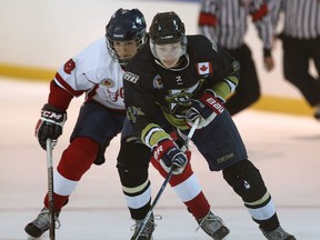 Leamington's Riley Meyerink (L) and LaSalle's Eric Kirby battle for the puck during their game Wednesday, September 2, 2015, at the Vollmer Centre in Lasalle. (DAN JANISSE/The Windsor Star)