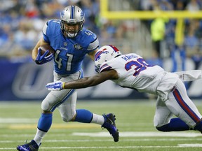 Detroit Lions running back Zach Zenner (41) runs the ball under pressure from Buffalo Bills strong safety Bacarri Rambo (30) in the first half of an NFL preseason football game, Thursday, Sept. 3, 2015, in Detroit. (AP Photo/Rick Osentoski)