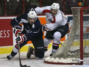 Windsor Spitfire Brandon Shea, left, gets pressured by Cristiano DiGiacinto during the team's blue and white game at the WFCU Arena on Thursday, Sept. 3, 2015.  (DAN JANISSE/The Windsor Star)