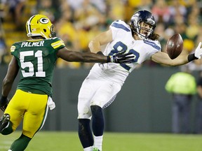 Seattle Seahawks' Luke Willson catches a pass in front of Green Bay Packers' Nate Palmer (51) during the second half Sunday, Sept. 20, 2015, in Green Bay, Wis. (AP Photo/Jeffrey Phelps)