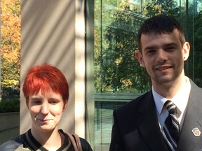 Michelle Arnold and Justin Pierce, both 21, are shown outside Vancouver Supreme Court on Friday Aug. 21, 2015. The couple have dropped an application to gain greater control of the care of their severely ill infant daughter, because she has been breathing without a ventilator for two weeks. THE CANADIAN PRESS/Laura Kane