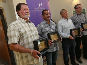 Kirk Windibank, Alan Quesnel, Rod Peturson and Rick Quesnel (left to right) are photographed at the Big Brothers Big Sisters of Windsor Essex County offices in Windsor on Thursday, September 3, 2015. The Quesnel brothers donated $200,000 to the organization. (TYLER BROWNBRIDGE/The Windsor Star)