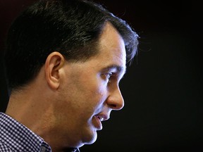 Republican presidential candidate Wisconsin Gov. Scott Walker speaks during a meet and greet with local residents, Wednesday, Aug. 26, 2015, in Harlan, Iowa. Walker appeared to entertain the idea of building a border wall with Canada when pressed Sunday in an interview about national security. THE CANADIAN PRESS/AP/Charlie Neibergall