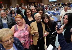 Dennis Solet poses for a photo with friends on Sunday, Sept. 13, 2015, at his "Let's say goodbye while we still have a chance" party at the Caboto Club in Windsor. ON.  (DAN JANISSE/The Windsor Star)